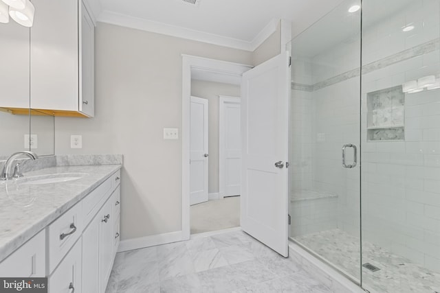 bathroom with ornamental molding, an enclosed shower, and vanity