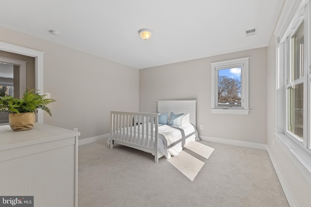 bedroom featuring light colored carpet