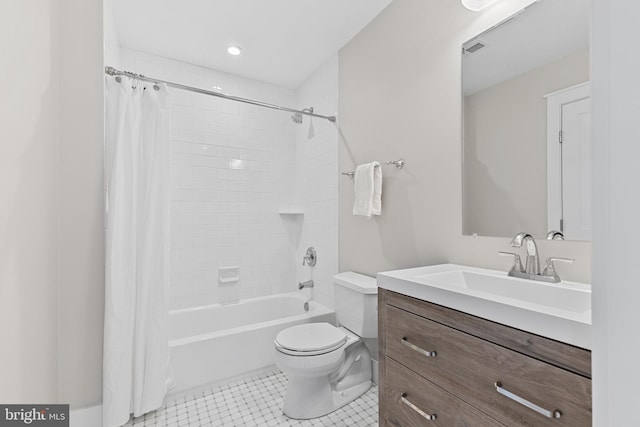 full bathroom featuring toilet, tile patterned flooring, vanity, and shower / bath combination with curtain