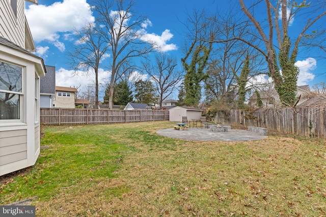 view of yard with a patio area and a storage shed