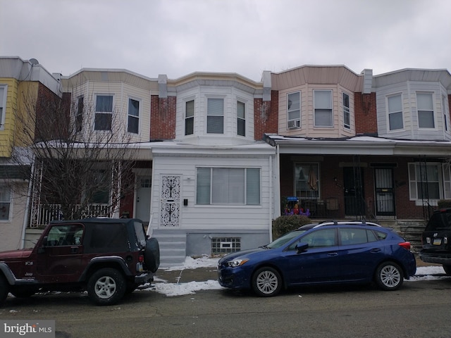 view of property featuring a porch