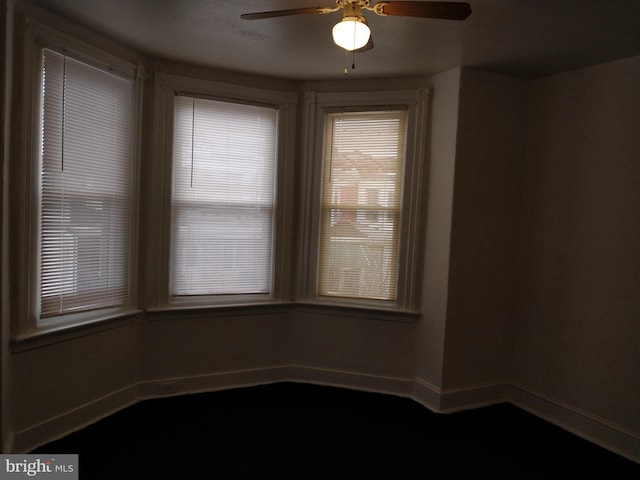 spare room featuring ceiling fan