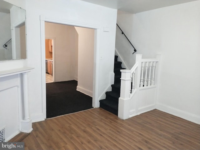 stairs with wood-type flooring