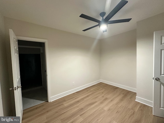 unfurnished room featuring ceiling fan and light hardwood / wood-style floors