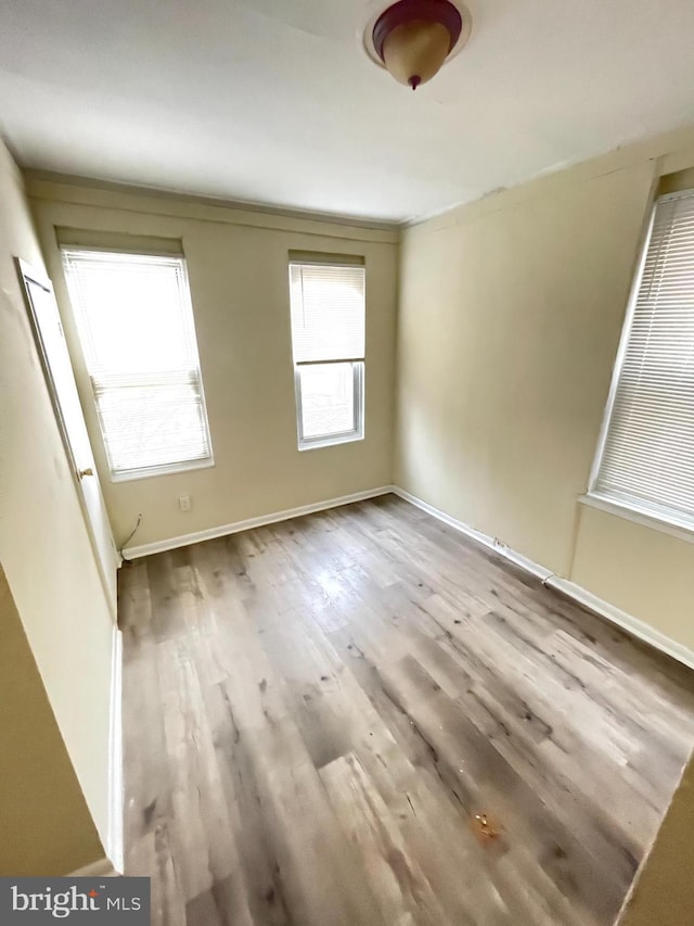 spare room with light wood-type flooring