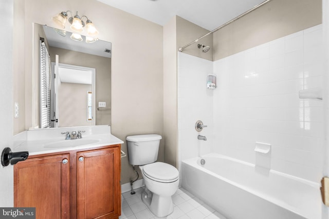 full bathroom with vanity, tiled shower / bath combo, tile patterned floors, and toilet