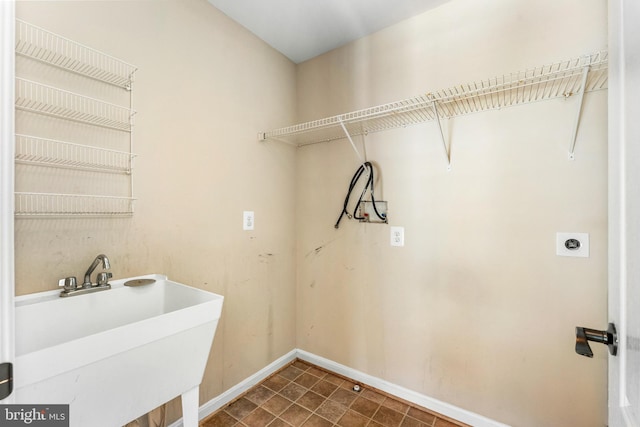 laundry area featuring sink and hookup for an electric dryer