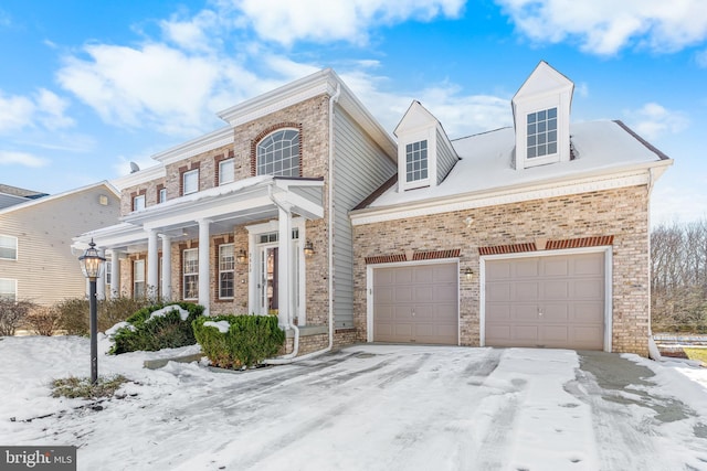 view of front of home featuring a porch and a garage