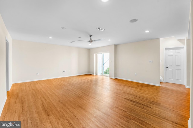 spare room with ceiling fan and light hardwood / wood-style flooring