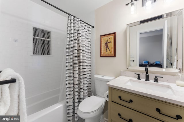 full bathroom featuring toilet, shower / bath combo, and vanity