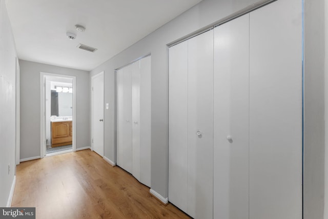 corridor featuring light hardwood / wood-style floors