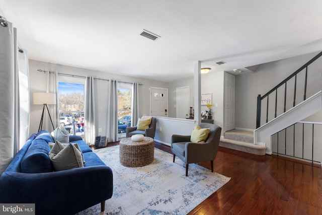 living room with dark hardwood / wood-style flooring