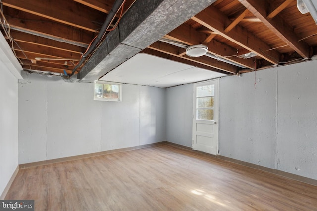 basement with wood-type flooring