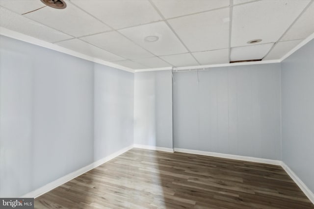 unfurnished room featuring a drop ceiling and hardwood / wood-style flooring