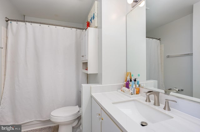 bathroom with toilet and vanity