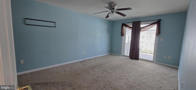 empty room featuring ceiling fan and light colored carpet