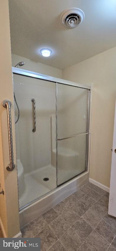 bathroom featuring walk in shower