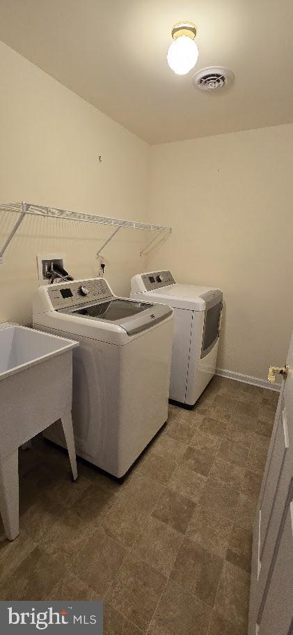 laundry area featuring independent washer and dryer