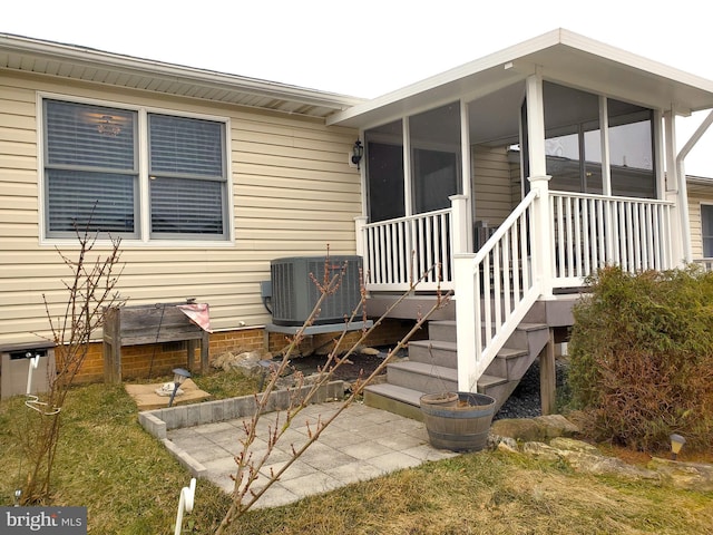 doorway to property with cooling unit