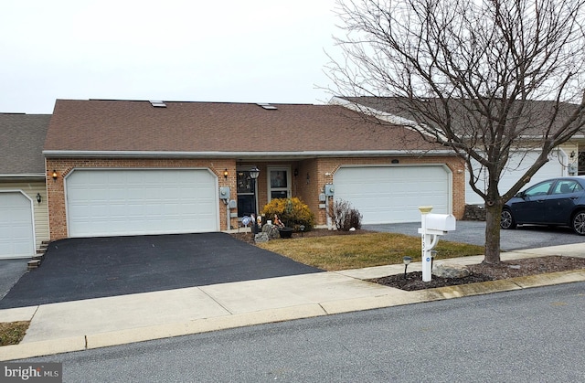 ranch-style house featuring a garage