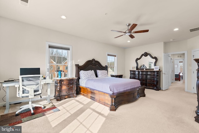 bedroom featuring ceiling fan and light colored carpet