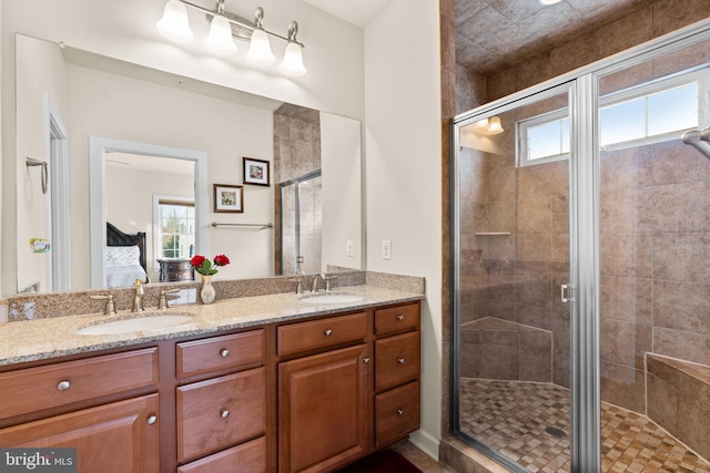 bathroom featuring vanity and a shower with door