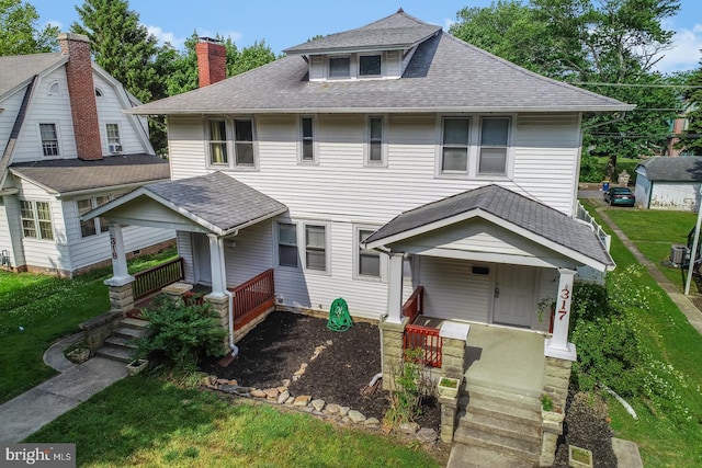 view of front of house with covered porch and central AC