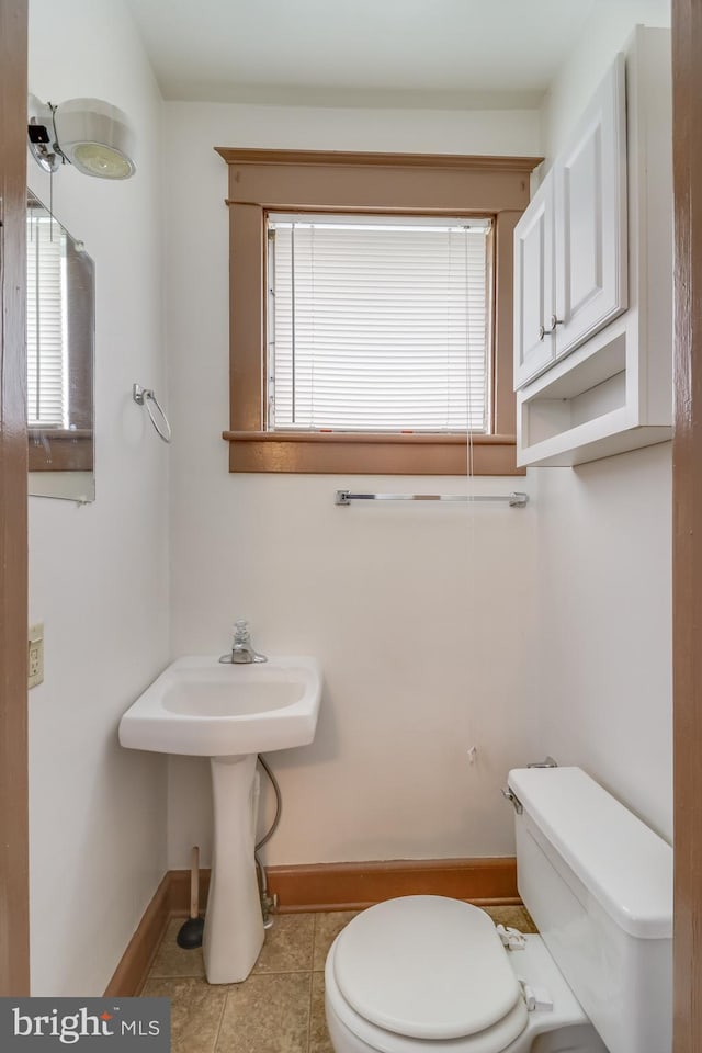 bathroom with tile patterned floors and toilet