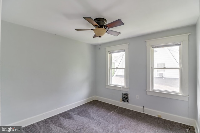 unfurnished room with ceiling fan and carpet floors