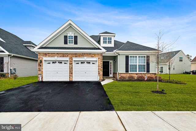 craftsman-style home featuring a garage and a front yard