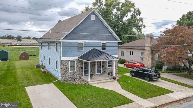 view of front facade with a porch and a front lawn