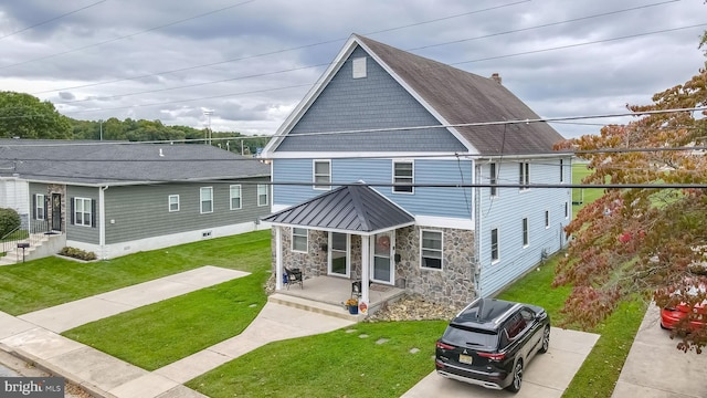 rear view of house with a yard