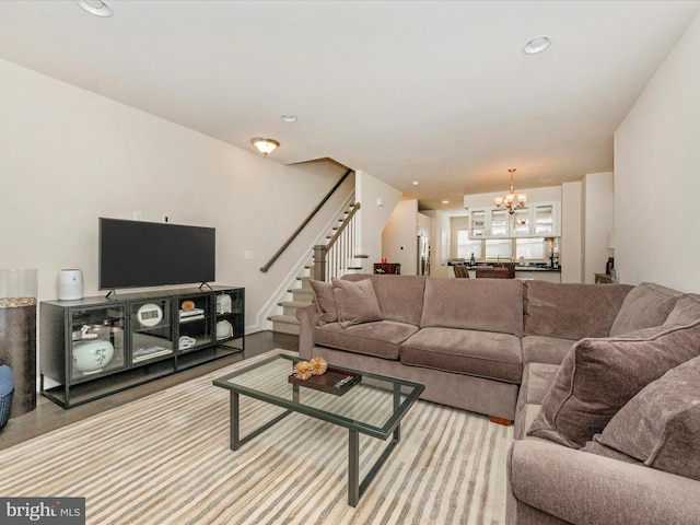 living room featuring light hardwood / wood-style flooring and a chandelier