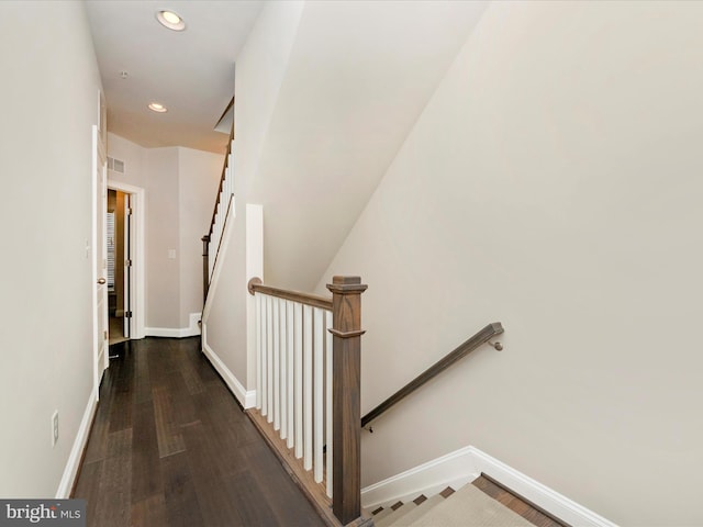 staircase with wood-type flooring