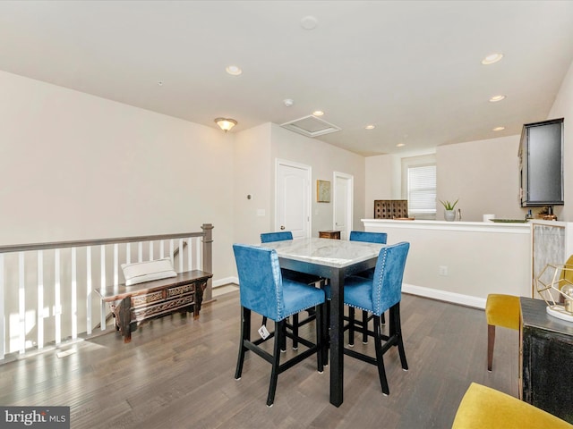 dining area featuring dark hardwood / wood-style flooring