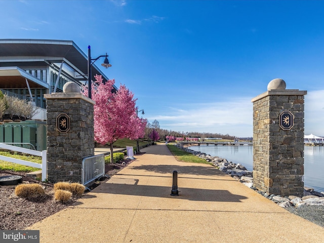 surrounding community featuring a water view