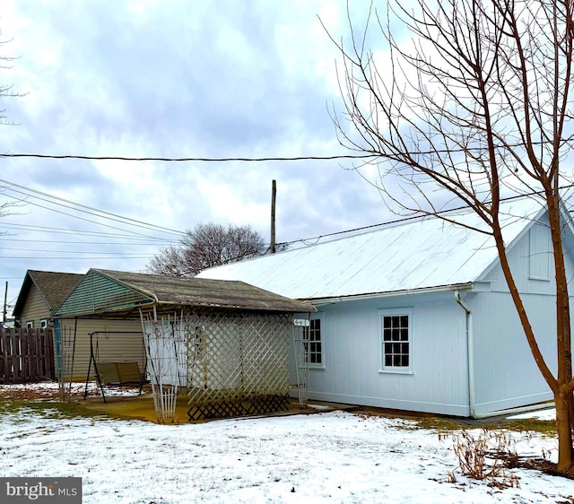 view of snow covered house