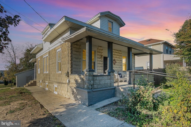 view of front of property featuring covered porch