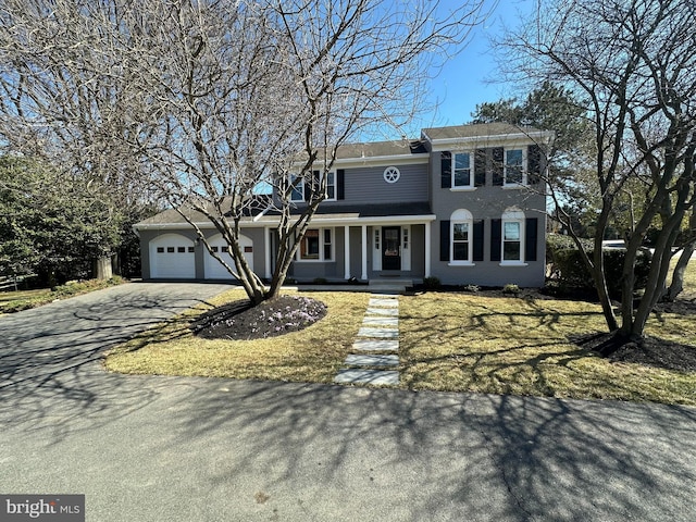 view of front of house featuring an attached garage and driveway