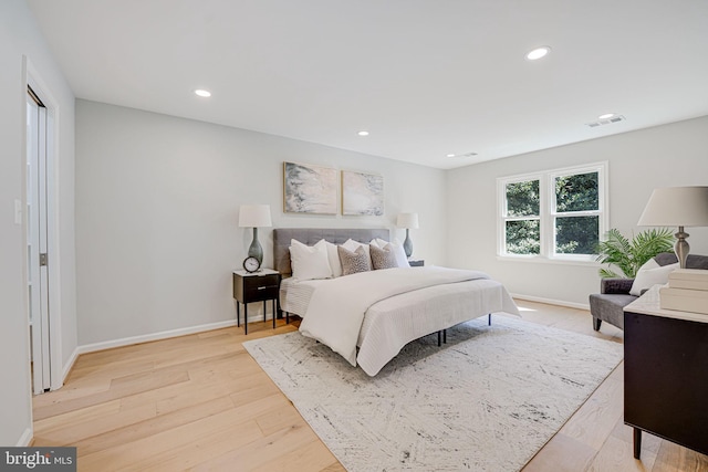 bedroom featuring recessed lighting, visible vents, baseboards, and light wood-style floors