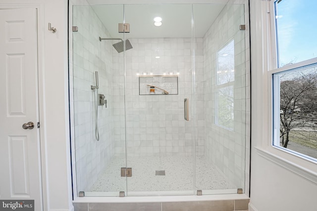 full bathroom with plenty of natural light and a stall shower