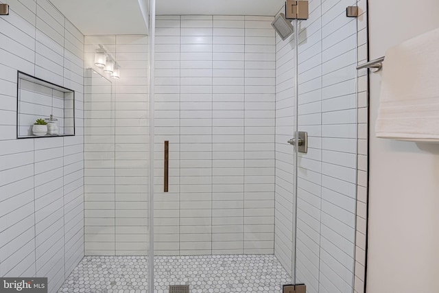 bathroom with a shower stall