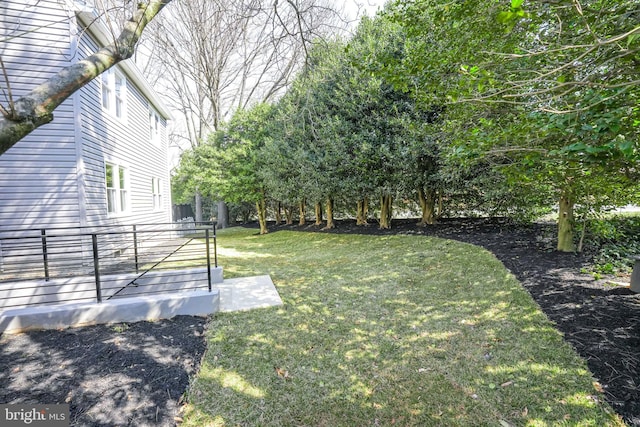 view of yard featuring a wooden deck