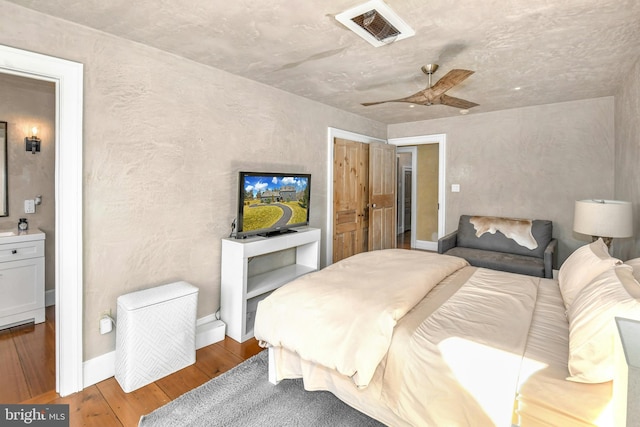 bedroom with hardwood / wood-style flooring and ceiling fan