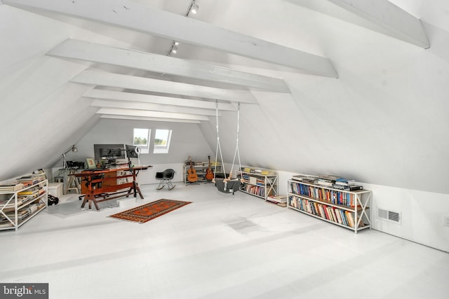 bonus room featuring vaulted ceiling with beams