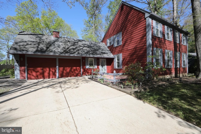 16 Doncaster Rd, Cherry Hill, NJ 08003 - view of front of house with a garage, a chimney, and concrete driveway
