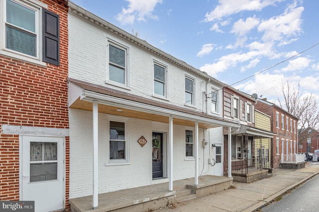 view of property featuring a porch