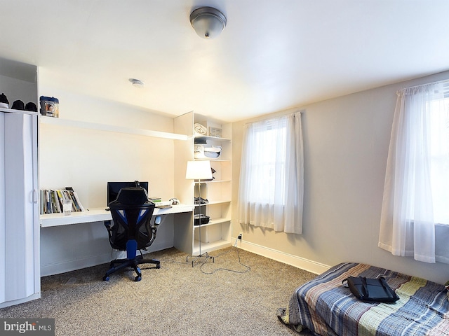 office featuring carpet flooring and built in desk