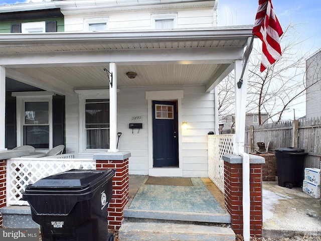 property entrance with covered porch