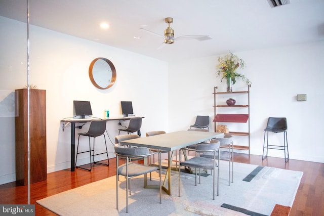 dining room with wood-type flooring and ceiling fan